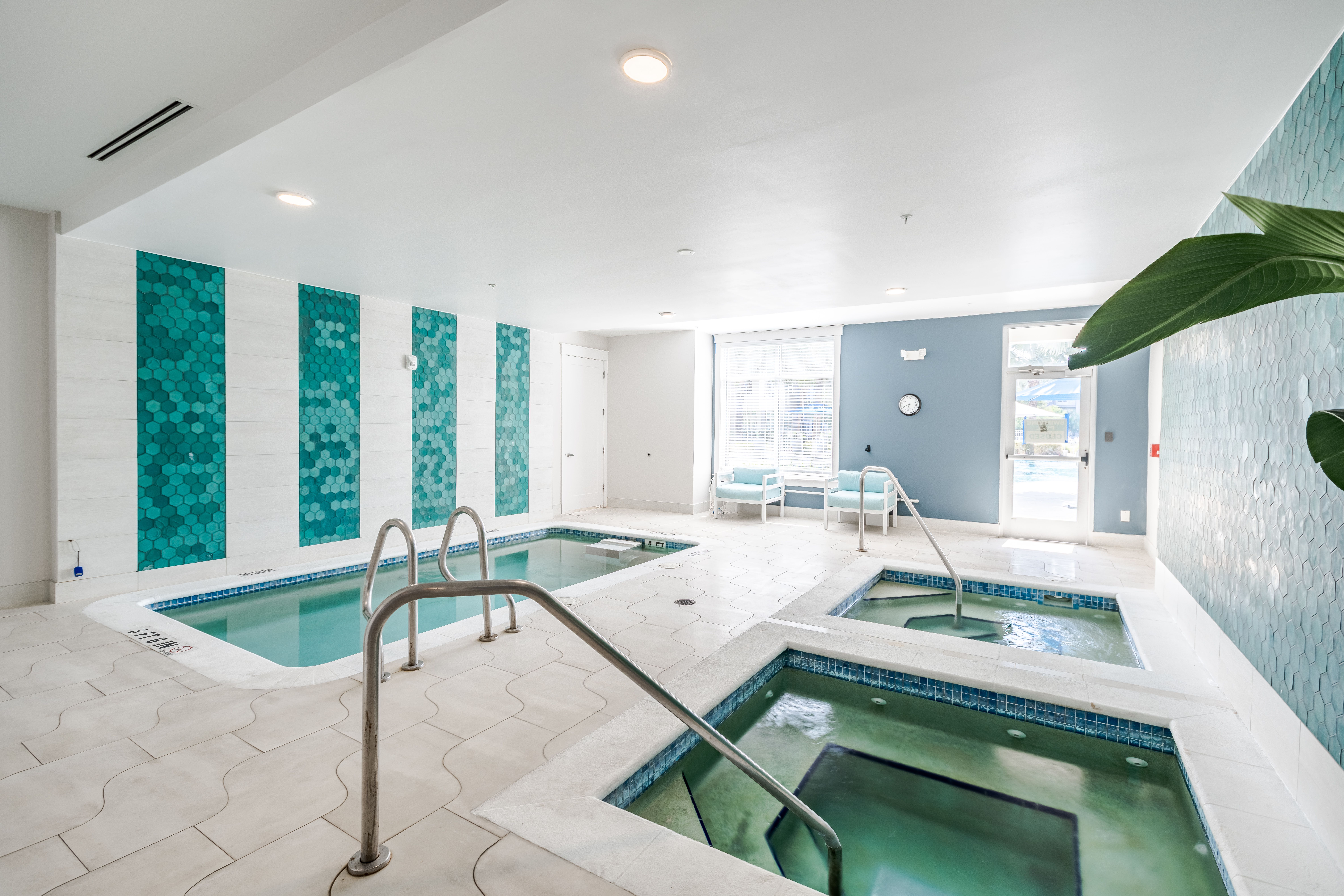 Solstice Apartments indoor spa and cold plunge with multiple pools