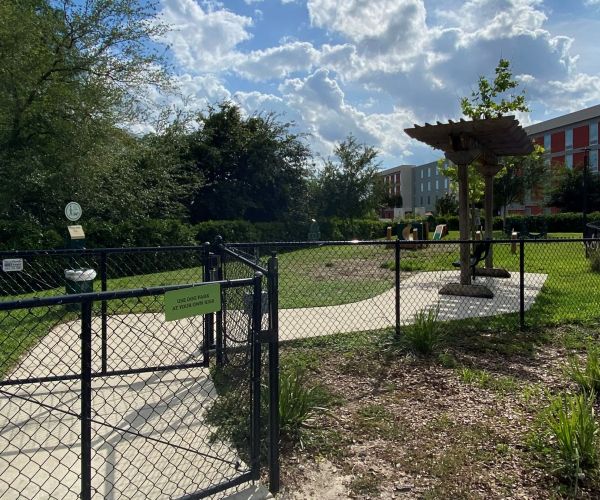 Outdoor Dog Park at Solstice Apartments with gate enclosure