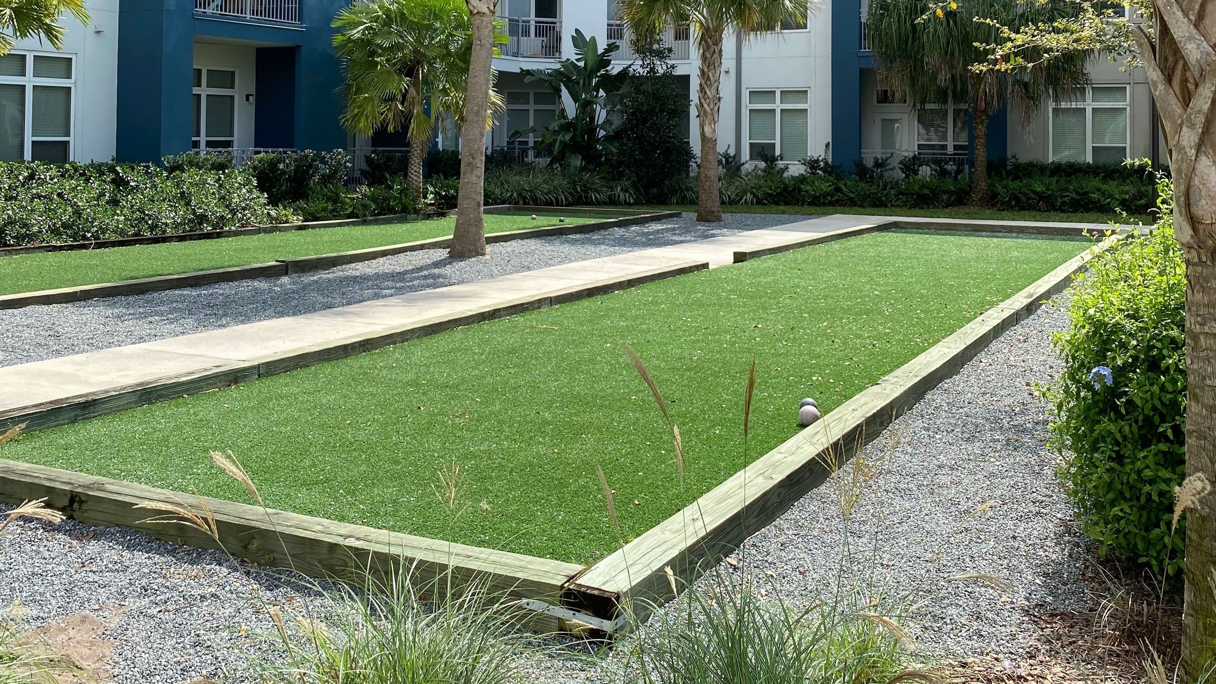 Bocci Ball Court at Solstice Apartments surrounded by lush landscaping