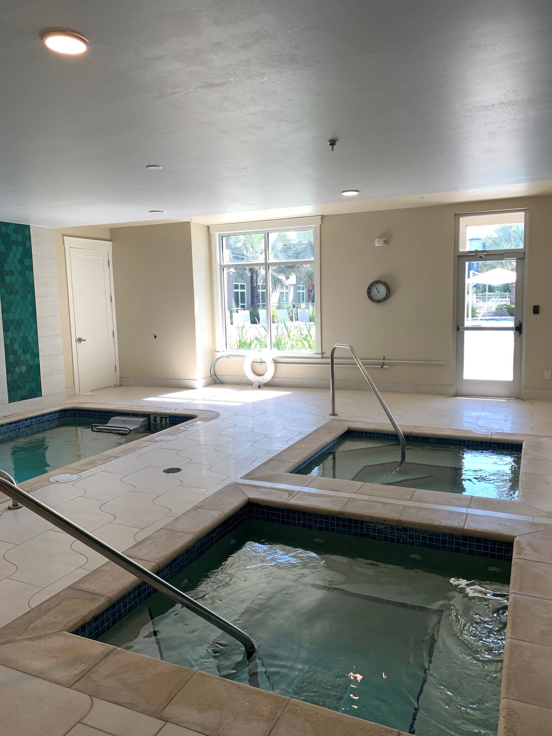 Solstice Apartments indoor spa and cold plunge with multiple pools