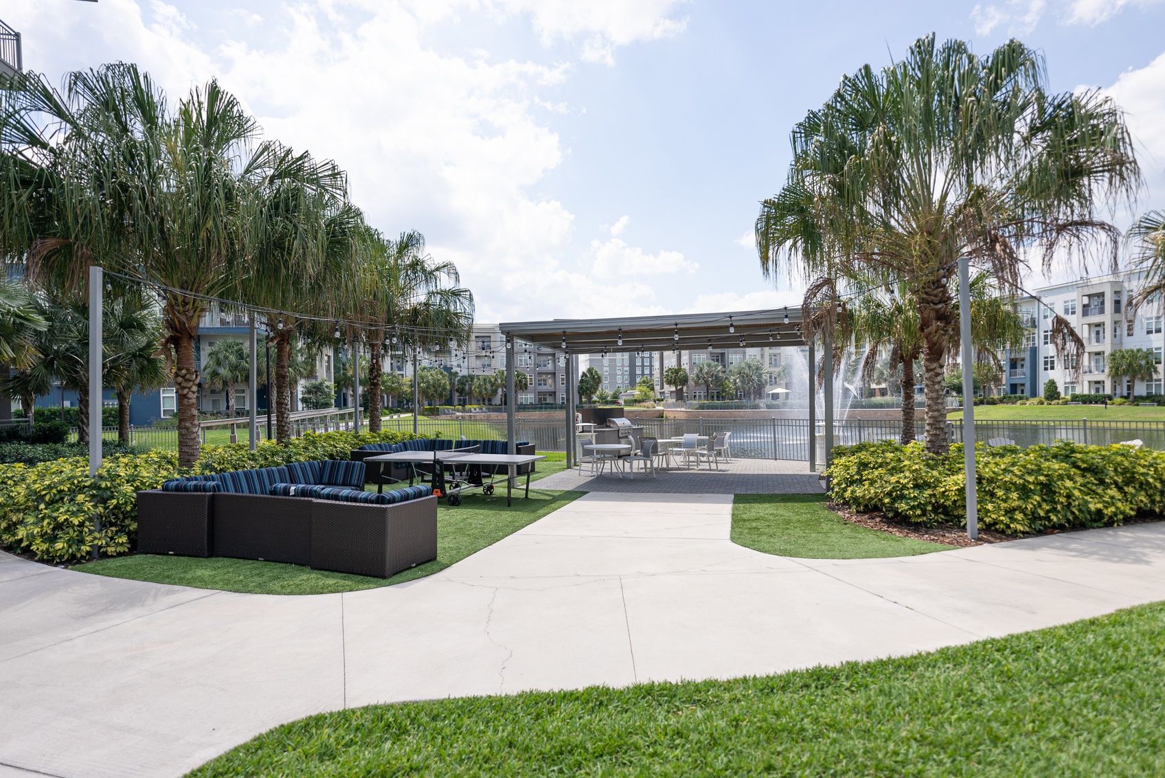 Solstice Apartments outdoor lounge area with lakeside view.