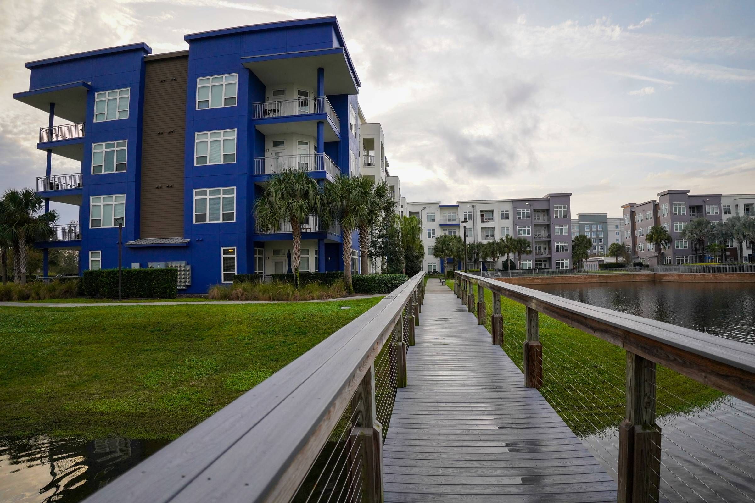 Natural community Jogging Trail at Solstice Apartments with bridge over water 