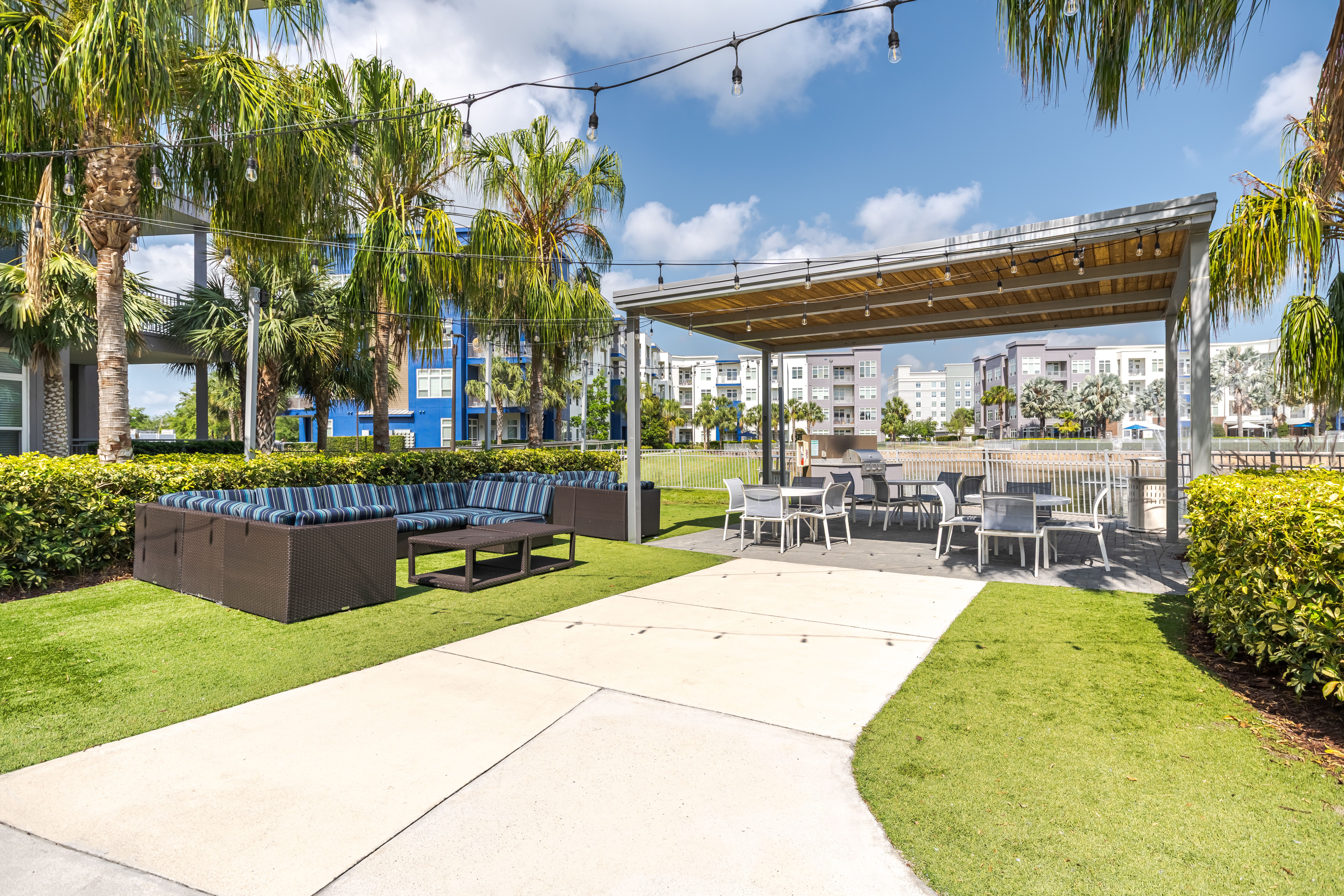 Solstice Apartments outdoor lounge area with lakeside view.
