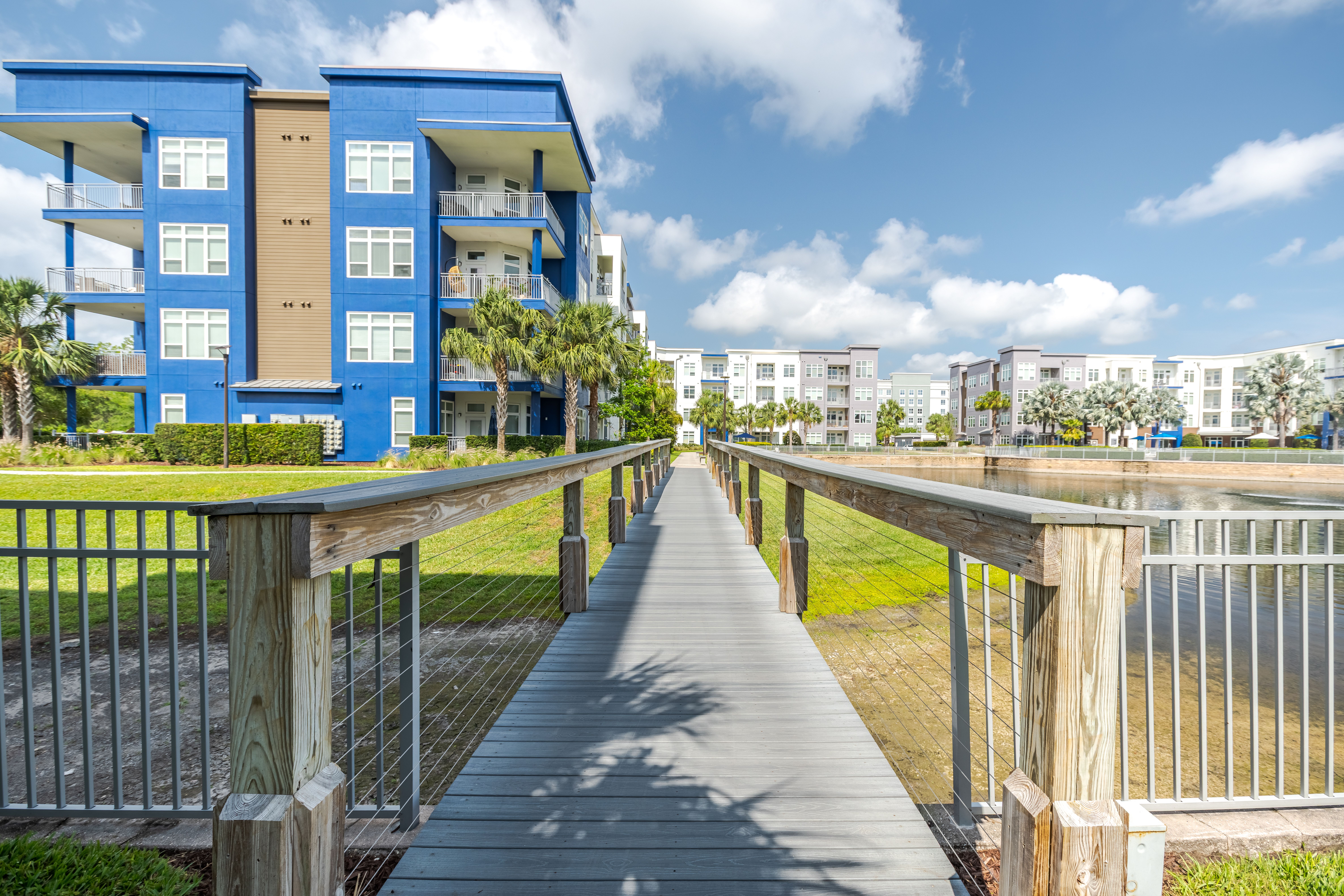 Natural community Jogging Trail at Solstice Apartments with bridge over water