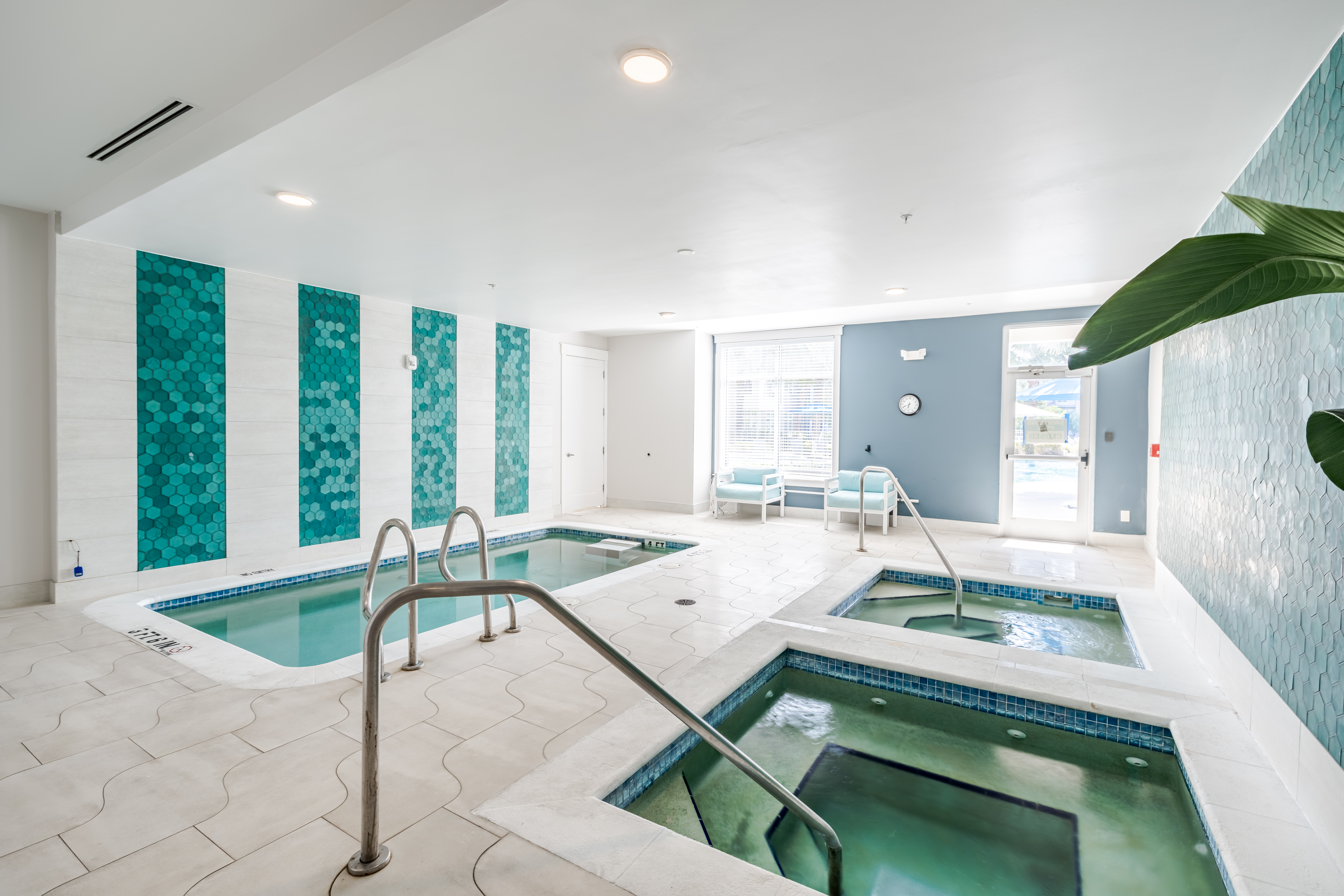 Solstice Apartments indoor spa and cold plunge with multiple pools