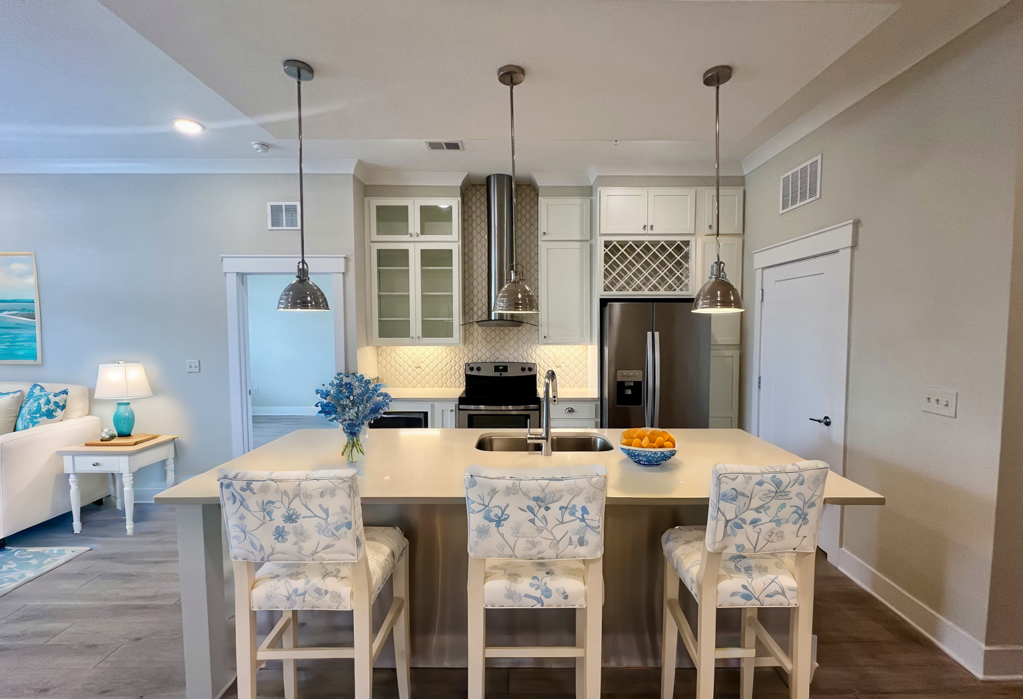 Luxury apartment kitchen with stainless steel appliances, granite countertops, and lots of storage space