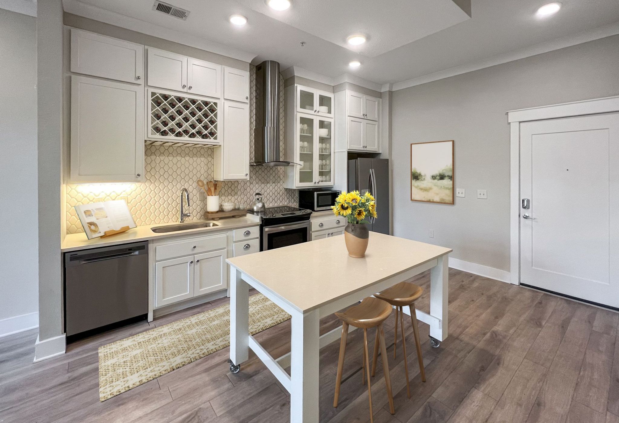 Luxury apartment kitchen with stainless steel appliances, granite countertops, and lots of storage space